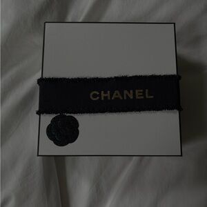 CHANEL Black Ribbon with Gold Logo Accent